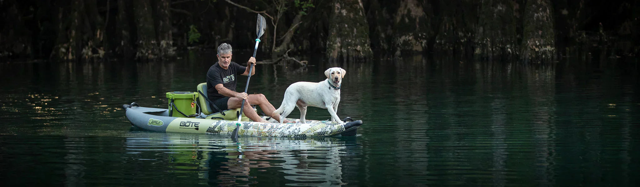 Man and dog on a BOTE Zeppelin Aero Inflatable Kayak