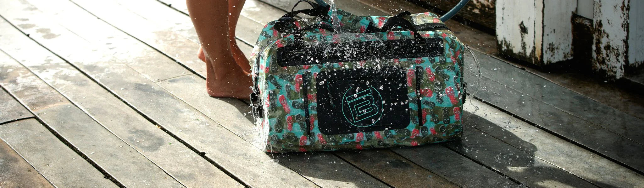 BOTE Waterproof duffel bag on wooden deck