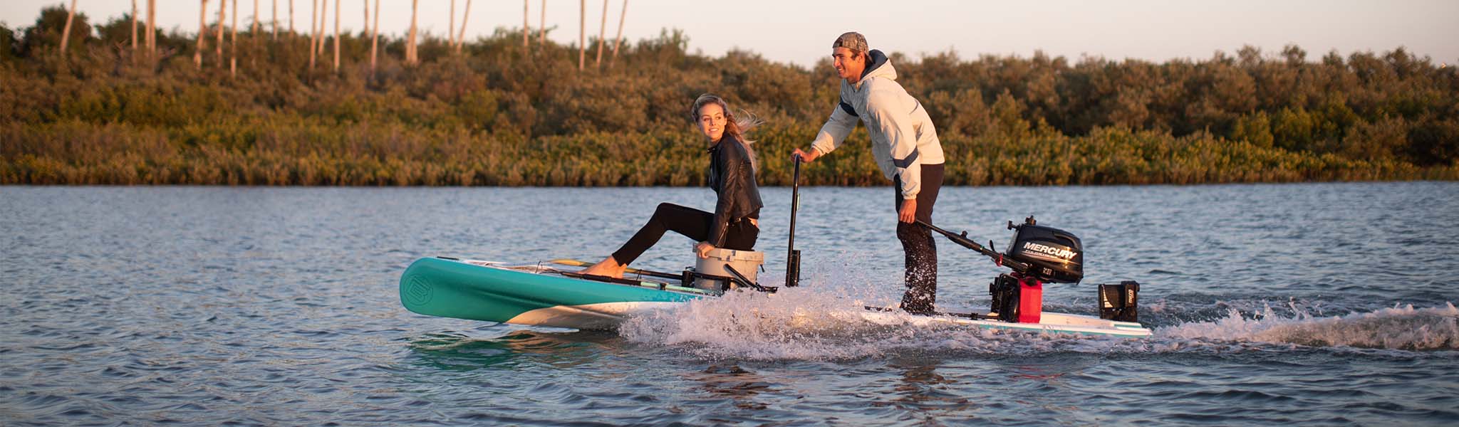 Bote micro skifss on river with motor and two people using it