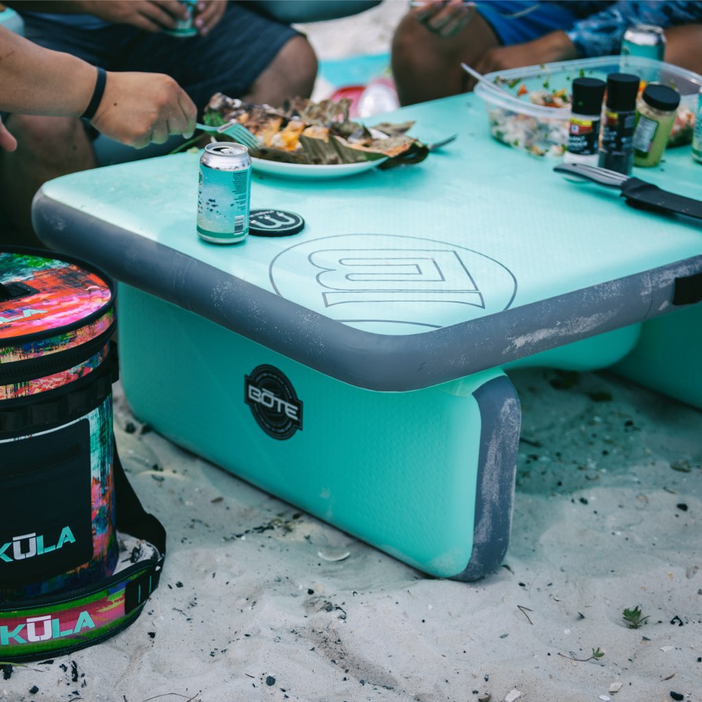 Lifestyle view of the Inflatable Aero Table Classic with food and drinks