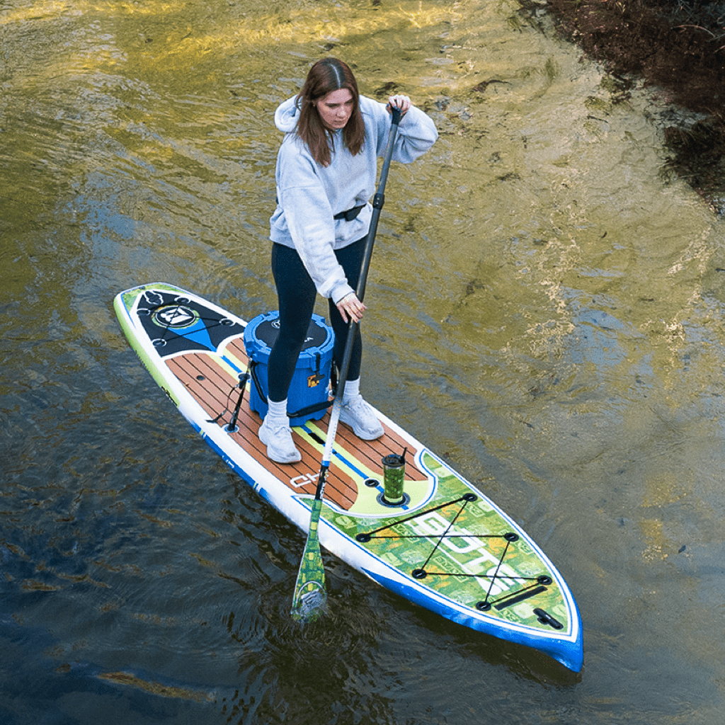 A girl paddling on the HD Native Nalu Paddle Board