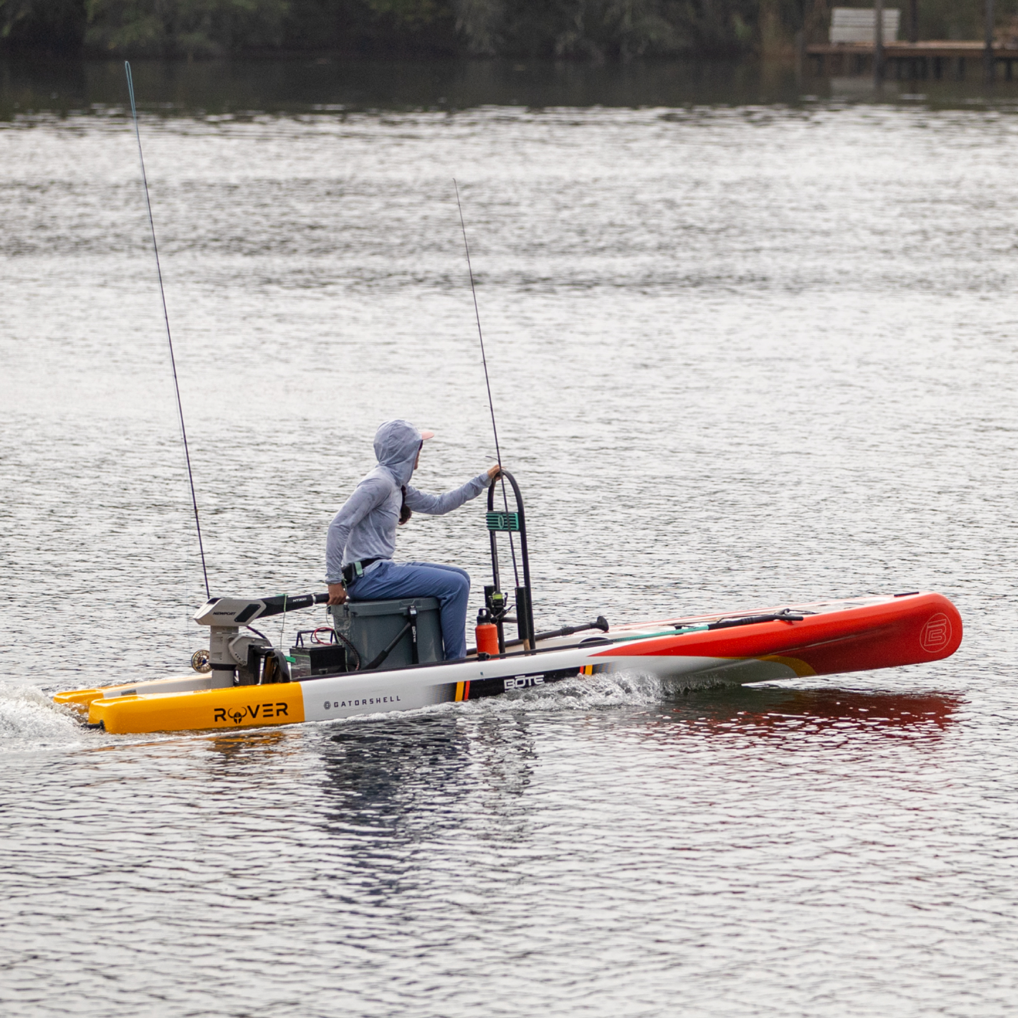 A person motoring on a Rover 14′ Fischer Cutthroat Micro Skiff