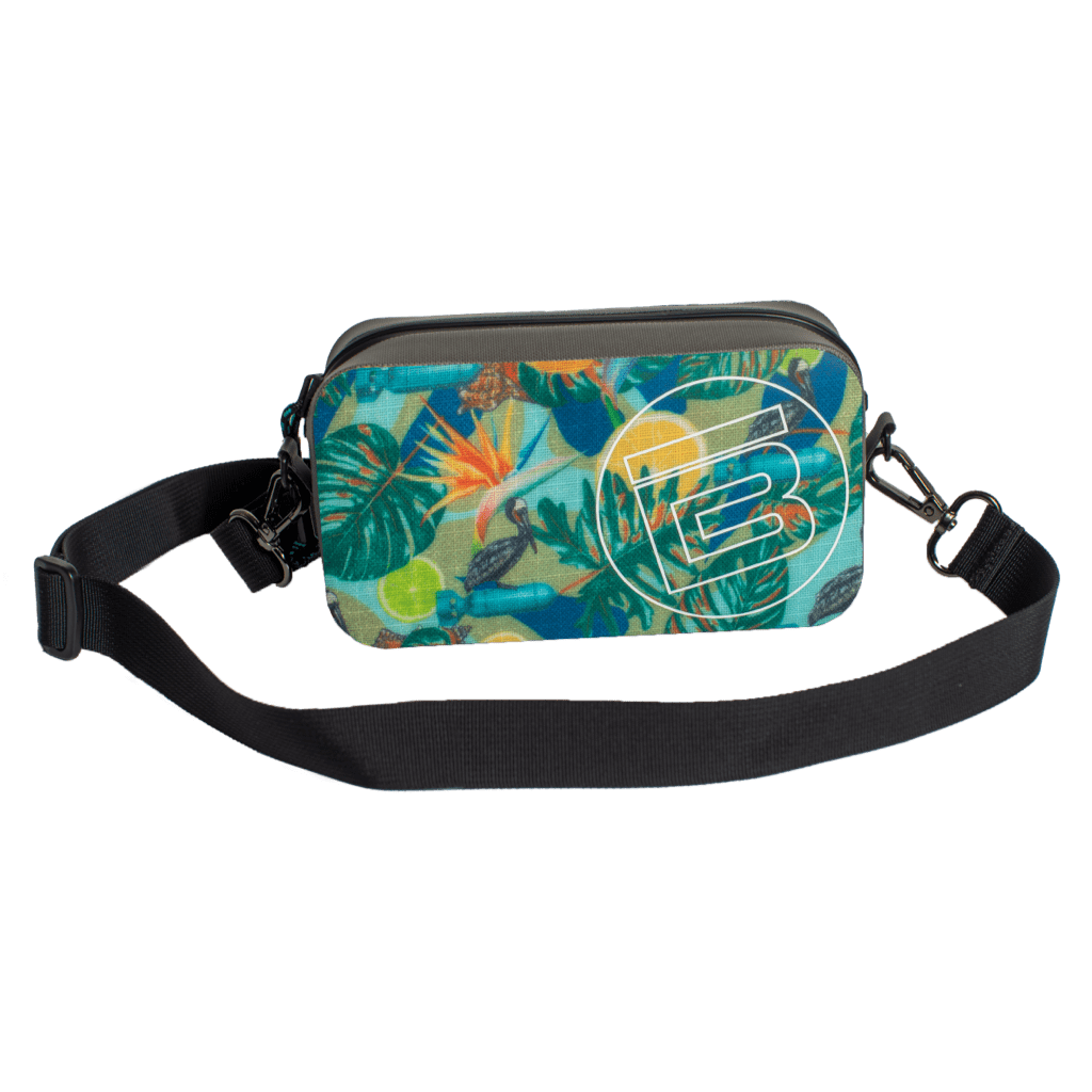 Front view of Highwater Hitchhiker Native Bombardier bag with tropical print and white BOTE logo.