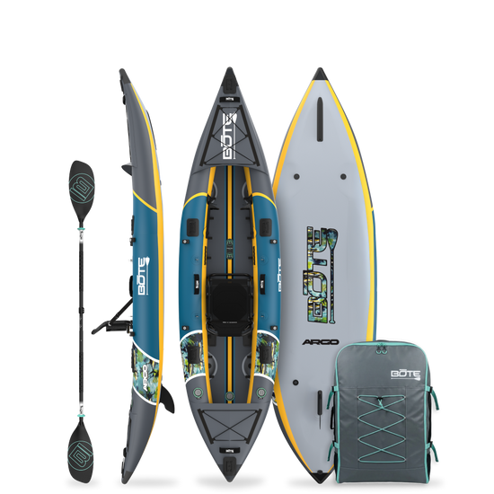 Top side and bottom view of an inflatable kayak with paddle and carrying bag on a white background