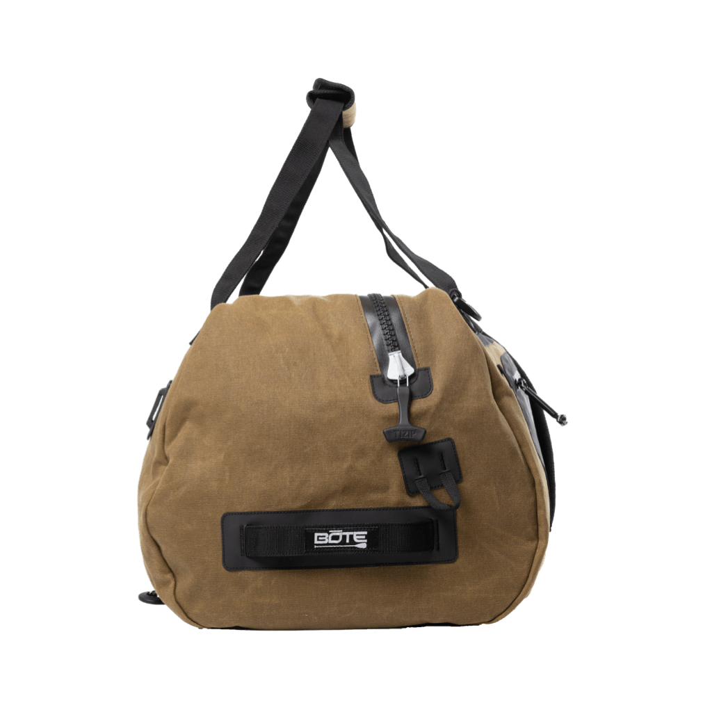 Side view of Highwater Duffel Last Cowboy highlighting zipper, handle, and buckle strap.